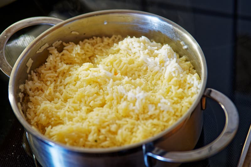 Cooking rice in a pot stock image. Image of white, produce 251174557