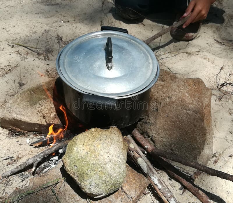 Cooking rice stock photo. Image of rice, fire, stone - 140287374