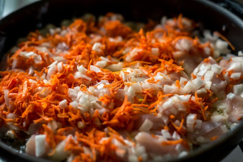 Cooking for Soup, Chopped Carrots and Onions are Fried in a Pan Stock