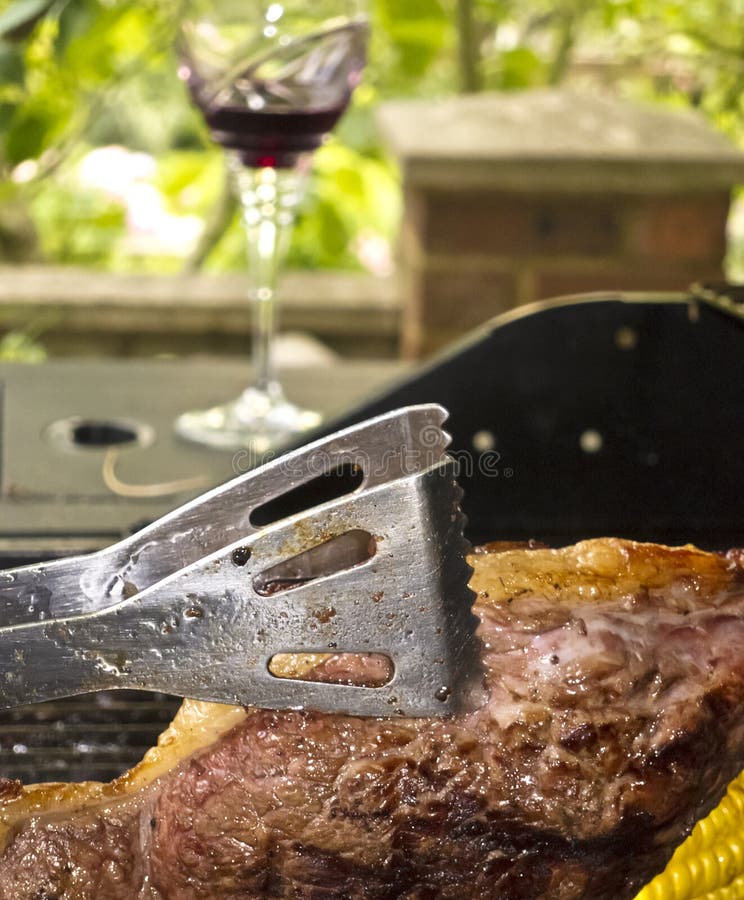 Cooking Steak On A Barbecue