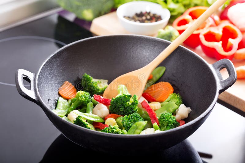 Cooking Stir Fried Vegetables in a Wok Stock Photo - Image of meal