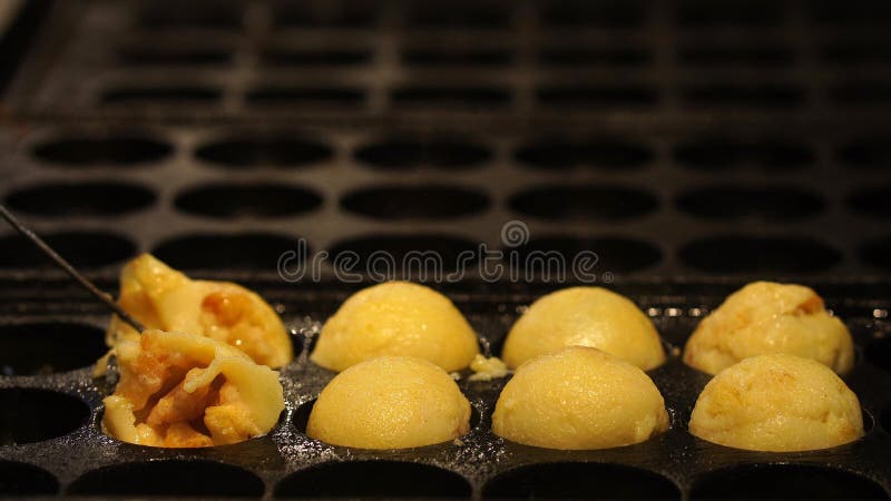 The Cooking of Takoyaki. the Popular Japanese Street Food. Stock Photo