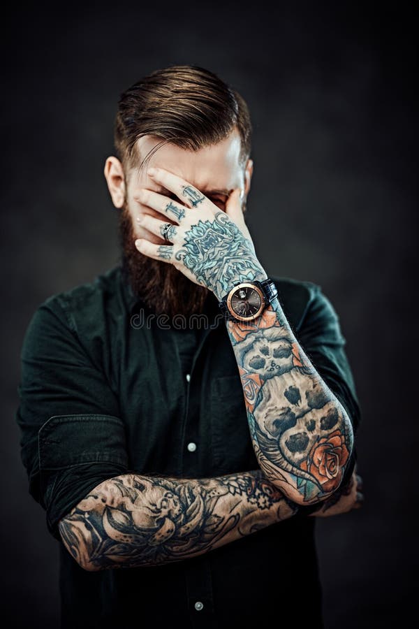 Cool Bearded Tattooed Man Posing on Camera Covering His Face with His Hand  Stock Image - Image of front, caucasian: 188077733