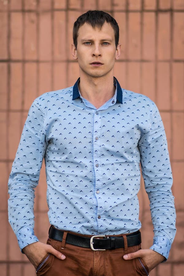 Cool Fashion Man in Blue Shirt Standing and Looking Away. Stock Photo ...