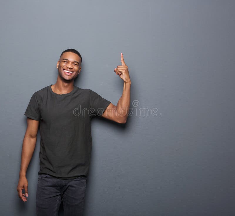 Cool guy smiling and pointing finger royalty free stock images