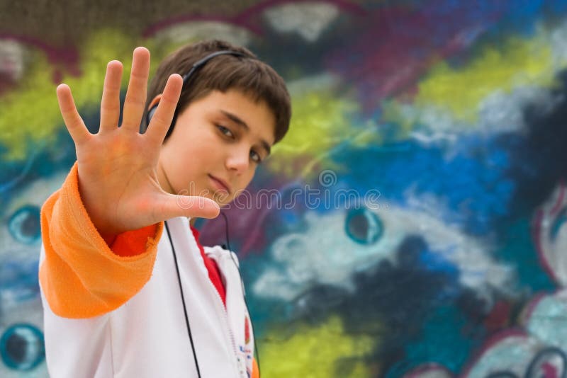 Cool teenager with his hand up