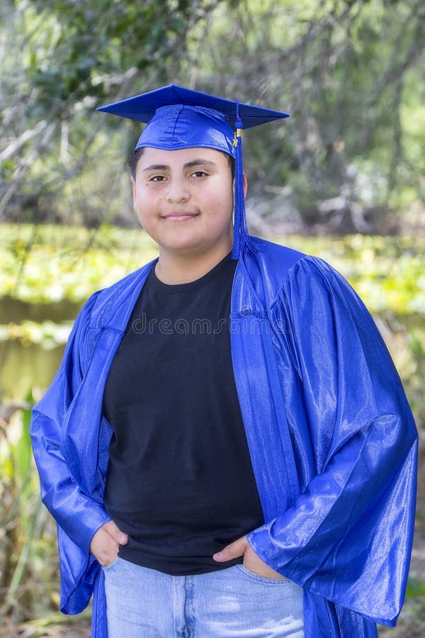 Cool, Young Graduate With Cap And Gown royalty free stock photo Cool, Young Graduate With Cap And Gown royalty free stock photo