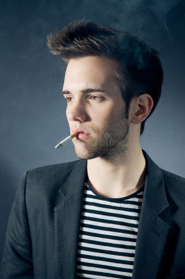 Cool young guy smoking stock photo. Image of smoking 19289220