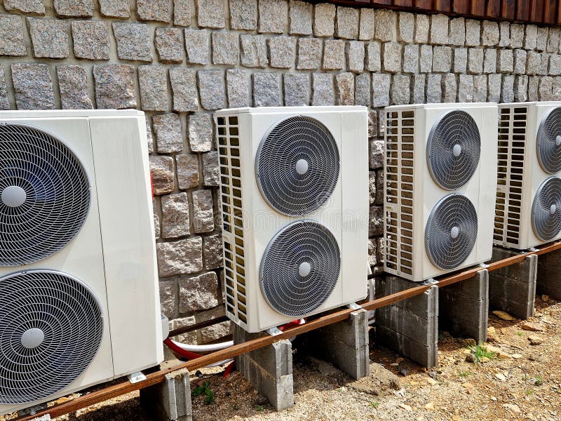Cooling units in a row in the backyard of a cabin in the mountains. royalty free stock images