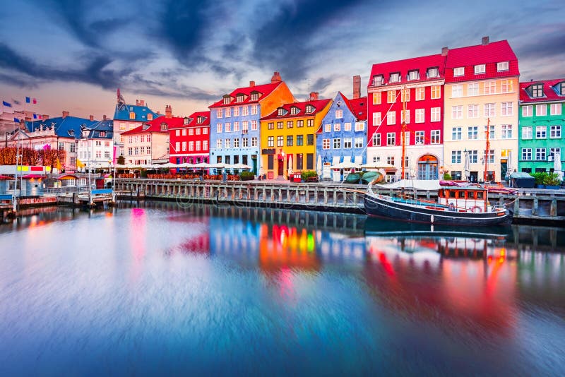 Charm of Copenhagen, Denmark at Nyhavn. Iconic canal, colorful night image and breathtaking water reflections. Charm of Copenhagen, Denmark at Nyhavn. Iconic canal, colorful night image and breathtaking water reflections