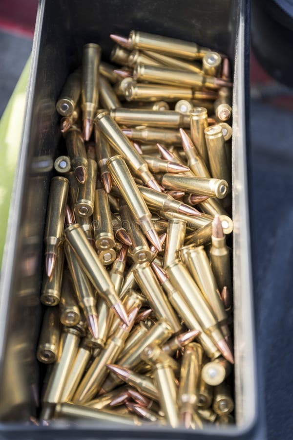 Copper Bullets 223 Ammo of a Rifle Inside a Black Container Stock Photo