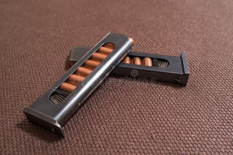 Copper Firearms Bullets and Pistol Clips. Weapon. Stock Image Image