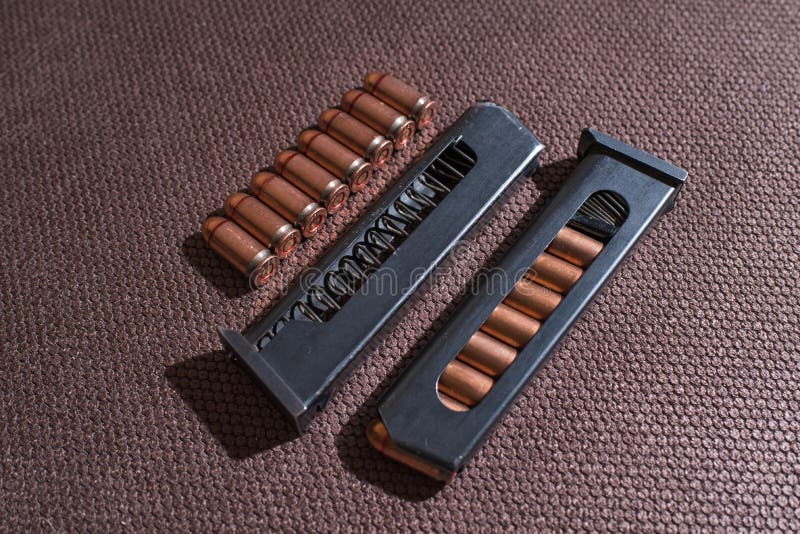 Copper Firearms Bullets and Pistol Clips. Weapon. Stock Image Image