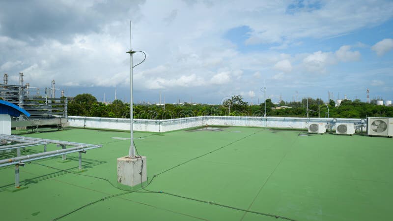 Copper grounding rod and lightning arrester installed at the highest point of a building royalty free stock photos
