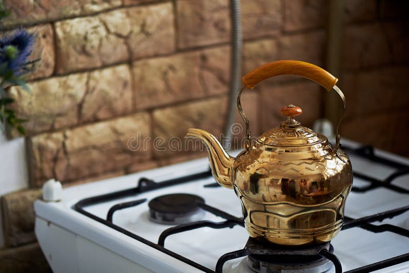 Copper Kettle Stands on an Old Vintage Plate. Kitchen Interior Stock Photo Image of orange