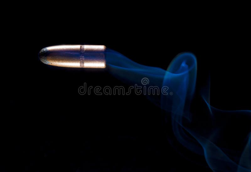 Speeding bullet and smoke stock images