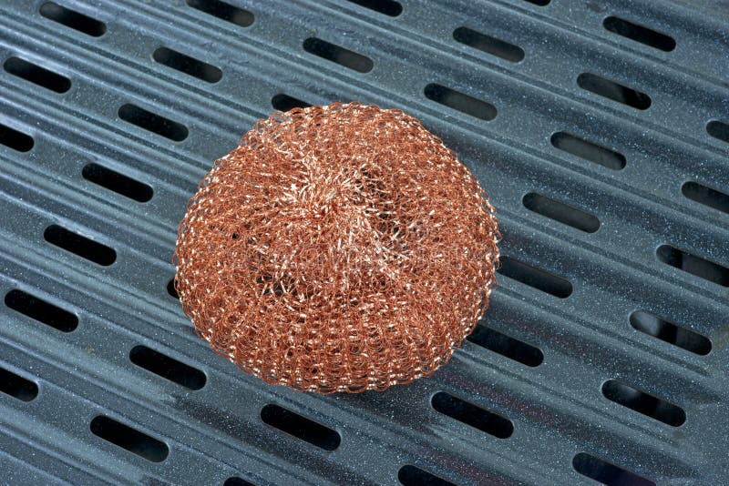 Copper scouring pad on pan stock photo. Image of abrasive 23403544