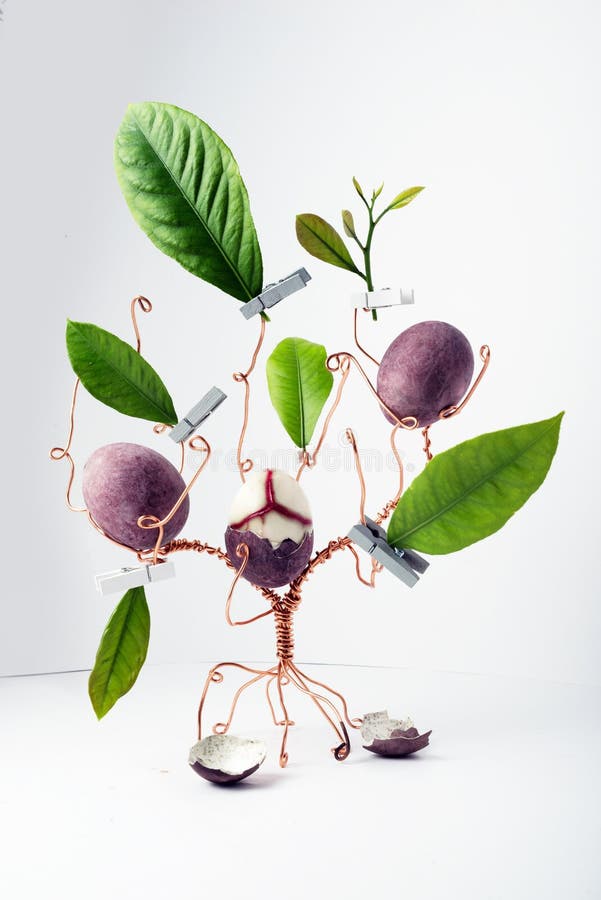 Copper Wire Tree Decorated with Painted Easter Eggs and Leaves Stock