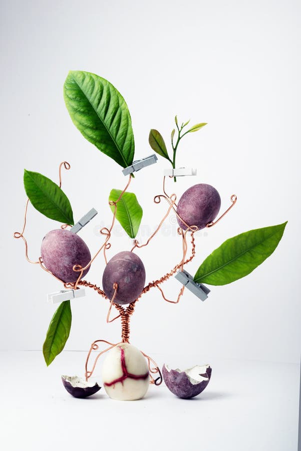 Copper Wire Tree Decorated with Painted Easter Eggs and Leaves Stock