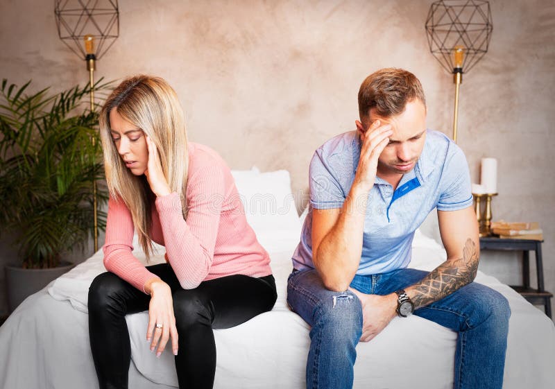 Couple sitting on bed and don`t speak to each other. Couple sitting on bed and don`t speak to each other