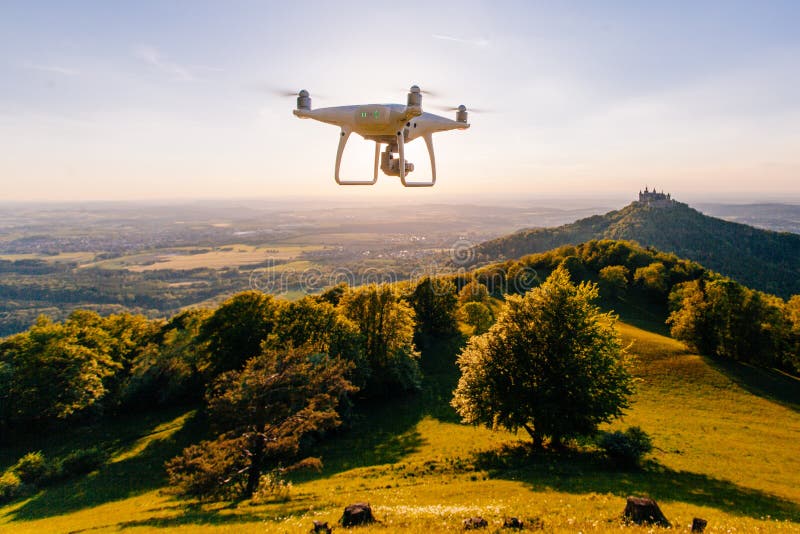 copter drone flying at sunset in hohenzollern castle area, Germany