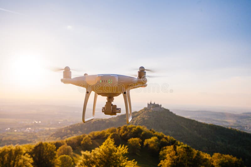 copter drone flying at sunset in hohenzollern castle area, Germany