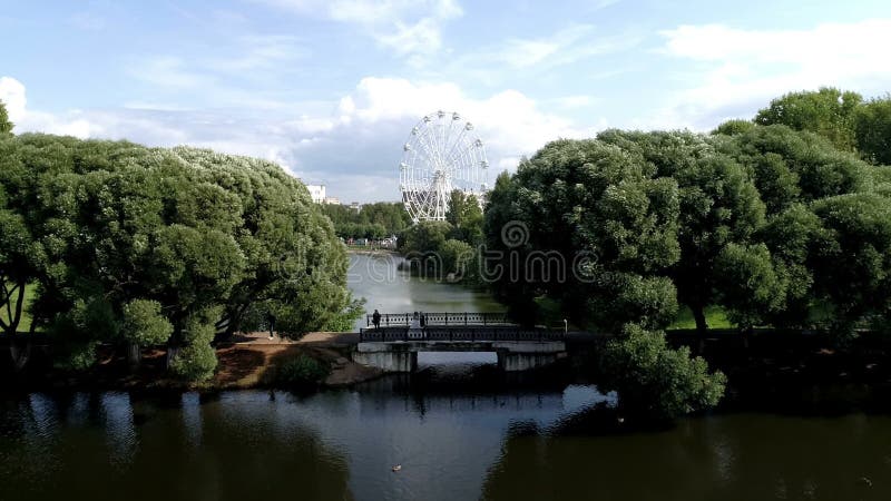 Copter flight over the city Park pond river