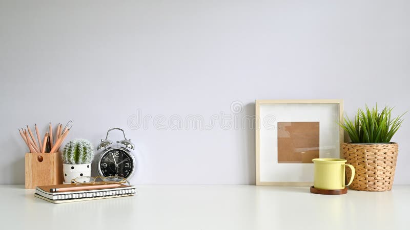 Copy space workspace with photo frame, coffee, plant decoration, pencil on office desk royalty free stock photography Copy space workspace with photo frame, coffee, plant decoration, pencil on office desk royalty free stock photography