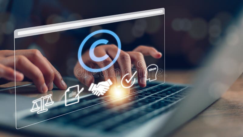 Copyright or patent concept, Person\'s hand using a laptop computer on a futuristic virtual interface screen. copyright icon royalty free stock photo
