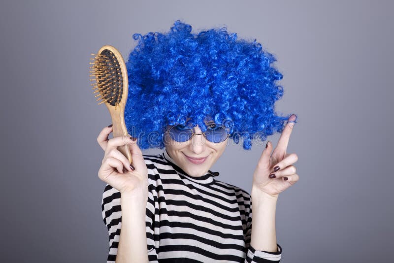 Coquette blue-hair girl with comb.