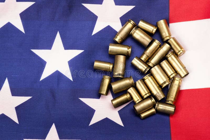 Coquilles sur le drapeau des USA photographie stock Coquilles sur le drapeau des USA photographie stock