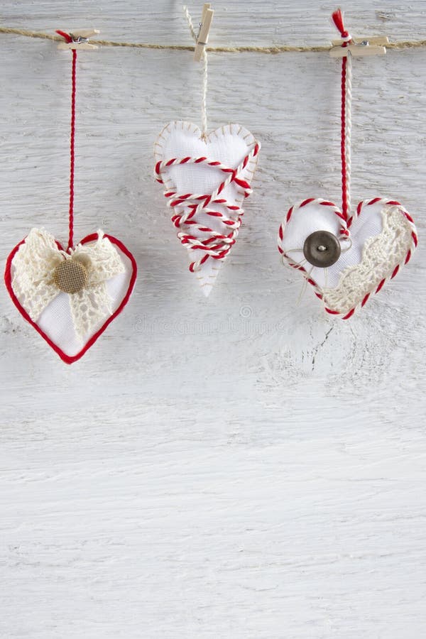 Handmade Valentines day hearts on white wooden background. Handmade Valentines day hearts on white wooden background