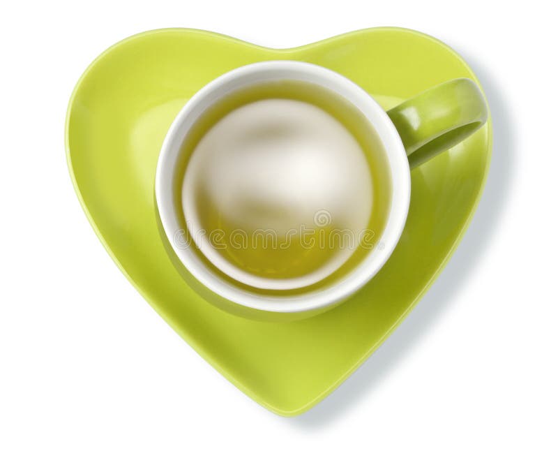 Corazón verde de la taza de infusión de hierbas fotos de archivo libres de regalías Corazón verde de la taza de infusión de hierbas fotos de archivo libres de regalías