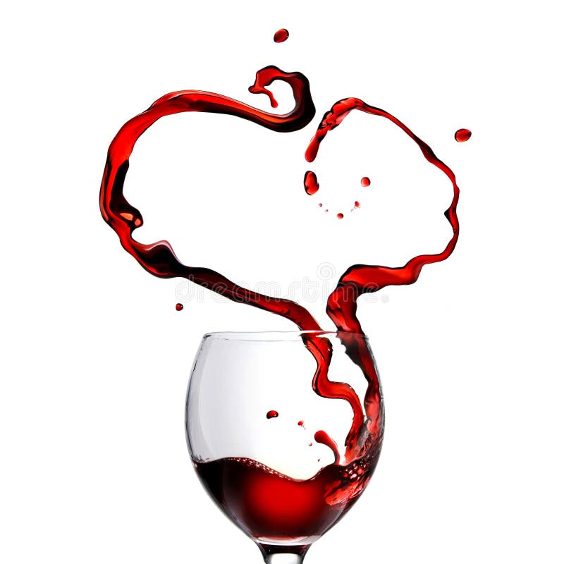 Heart made of pouring red wine in glass isolated on white. Heart made of pouring red wine in glass isolated on white