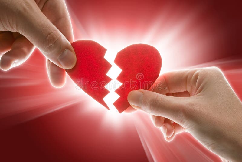 Female and man's hands with broken heart. Female and man's hands with broken heart