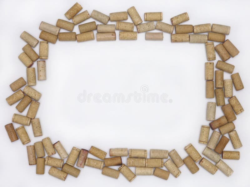 Corchos en blanco del vino que crean un marco contra un fondo blanco imágenes de archivo libres de regalías Corchos en blanco del vino que crean un marco contra un fondo blanco imágenes de archivo libres de regalías