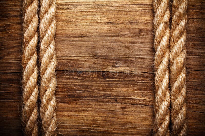 Rope on weathered wood background. Rope on weathered wood background