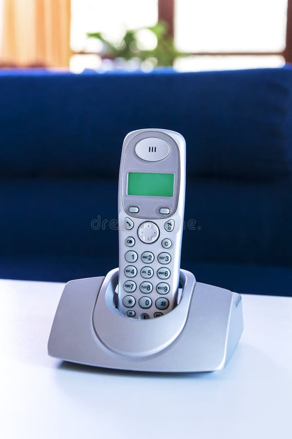 Cordless phone on a table stock image. Image of electronic 50708669