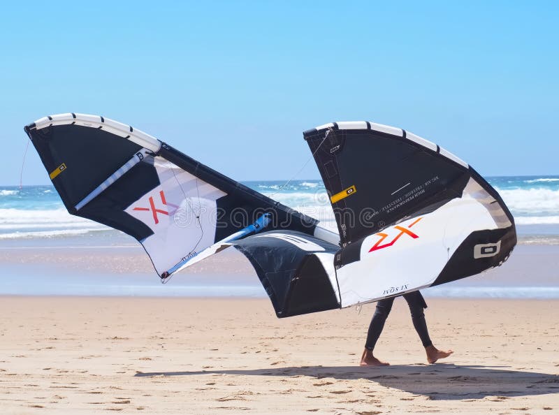 Core Kite Surfing Umbrella and Surfer at the Beach Editorial Stock