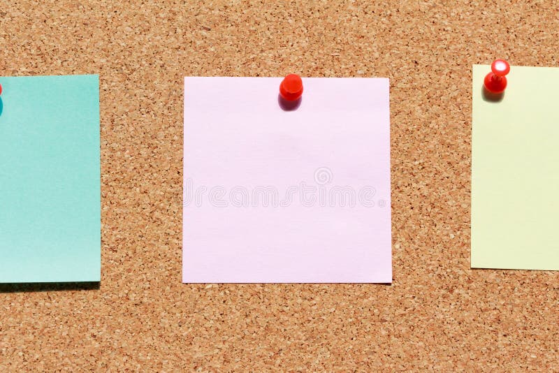 Cork board with colorful blank notes and push pins stock photo Cork board with colorful blank notes and push pins stock photo