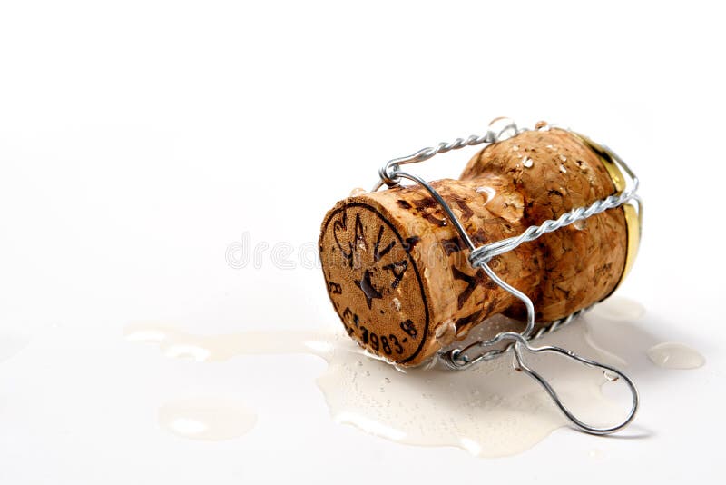 Cork in spilled champagne royalty free stock images