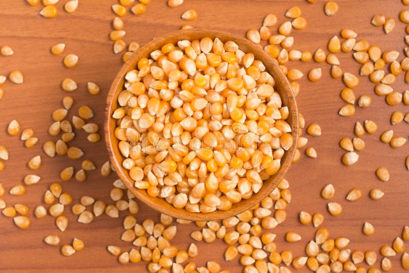Corn into a bowl. PopCorn stock image. Image of macro 76536159