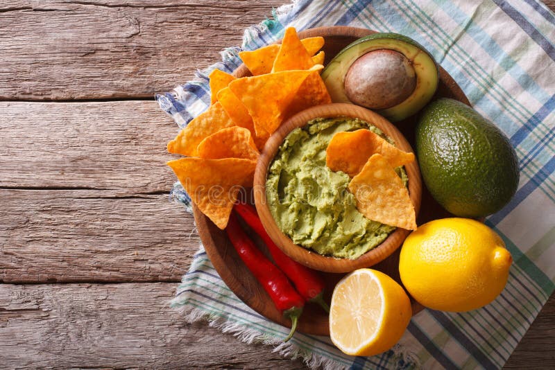 Corn Chips, Sauce Guacamole and Ingredients. Horizontal Top View Stock