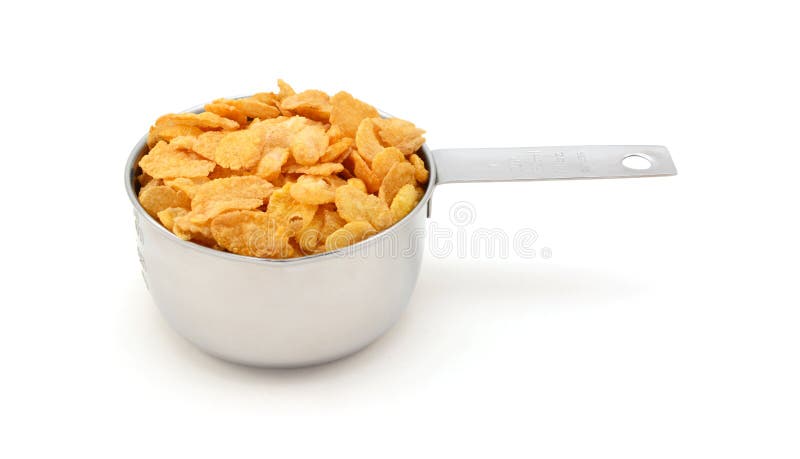 Corn flakes breakfast cereal in a measuring cup