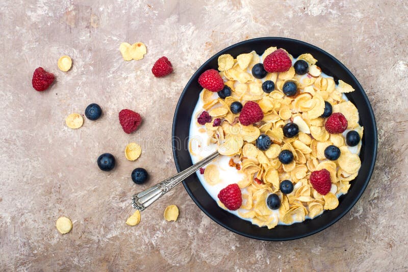 Corn Flakes with Milk, Blueberries and Raspberries Stock Photo Image