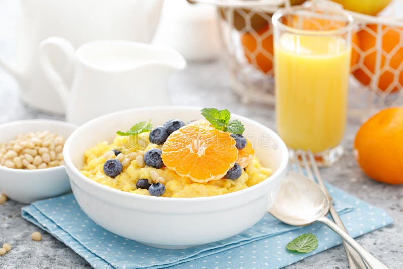 https://thumbs.dreamstime.com/b/corn-porridge-fresh-blueberry-orange-pine-nuts-bowl-served-breakfast-corn-porridge-fresh-blueberry-orange-166594231.jpg