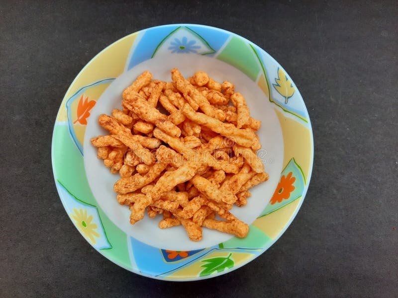 Corn Spicy Sticks Snacks In Bowl Isolated On Black Background Stock ...