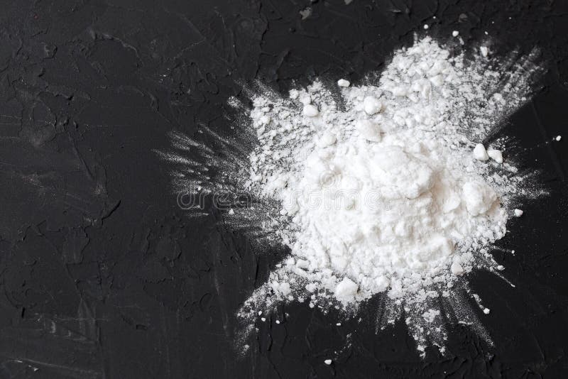 Corn Starch with Yellow Grains on a Black Background. Corn White Starch