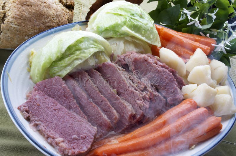 Hot Corn Beef and Cabbage dinner platter including carrots, potatoes, Irish Soda bread and a Shamrock plant. Hot Corn Beef and Cabbage dinner platter including carrots, potatoes, Irish Soda bread and a Shamrock plant.