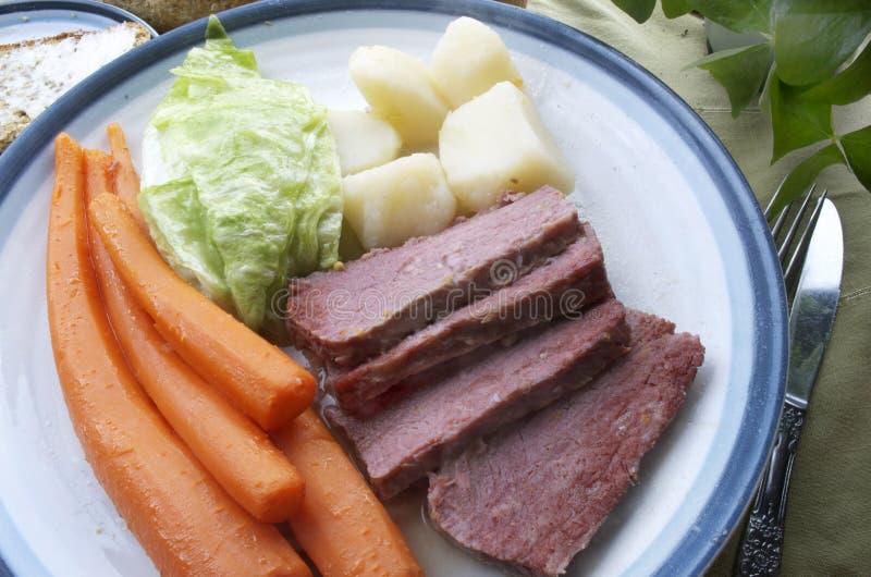 Corned Beef And Cabbage Plate. Hot Corn Beef and Cabbage dinner plate including carrots,and potatoes royalty free stock photography